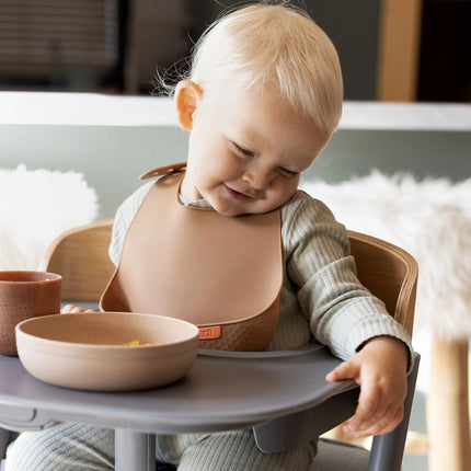 Silikonový bryndák s kapsou Nude